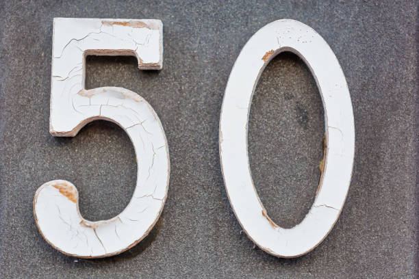 istock Old Weathered House Number 50, Tile on Wall 1474850888