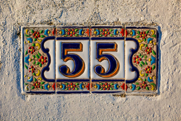 istock Old Weathered House Number 55, Tile on Wall 1474850919
