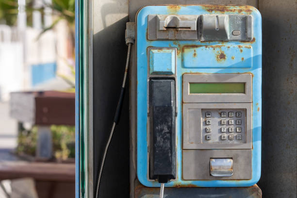 istock Abandoned and Rusty Public Phone, Obsolete Payphone 1474851113