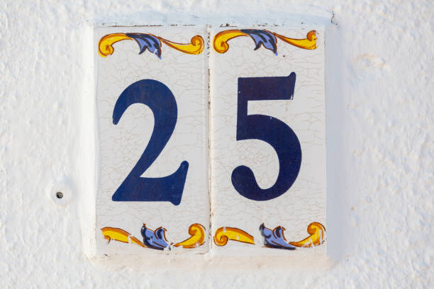 Old Weathered House Number 25, Tile on Wall stock photo