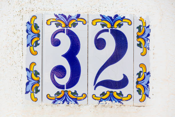 istock Old Weathered House Number 32, Tile on Wall 1474851212