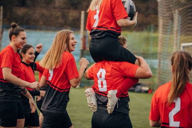 istock Female rugby team celebrating victory 1474852004