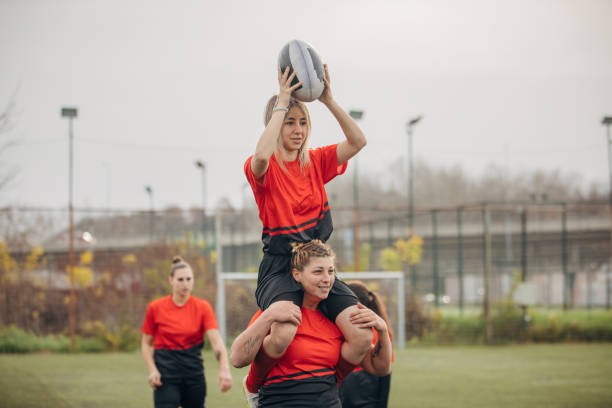 istock Female rugby team celebrating victory 1474852980