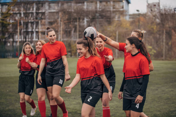 istock Female rugby team celebrating victory 1474853255