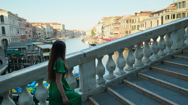 Female tourist exploring the Rialto Bridge.