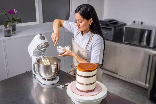 istock Colombian pastry chef mixes ingredients with a food processor 1474858429