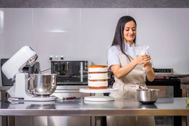 istock Colombian pastry chef preparing a sleeve pastry bag 1474858931