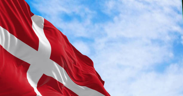 istock Denmark national flag waving in the wind on a clear day. 1474859561