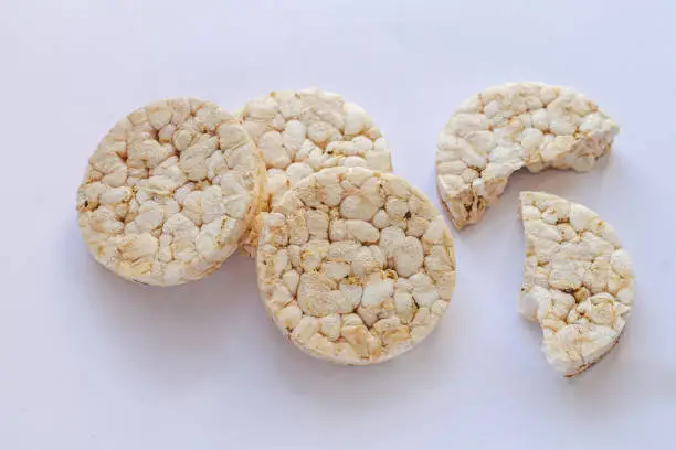Group of puffed rice crackers on white background. Top view