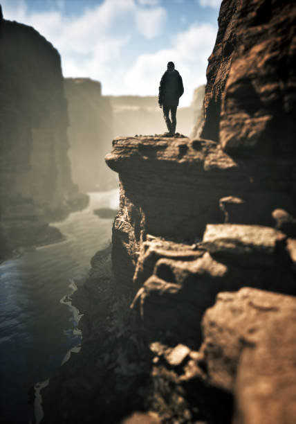 Man walks on edge of a canyon. 3D rendering.