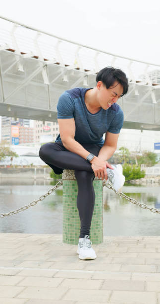 istock man has ankle pain injury 1474860495