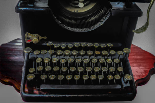 istock Vintage typewriter with golden keys isolated on a white background. 1474863084