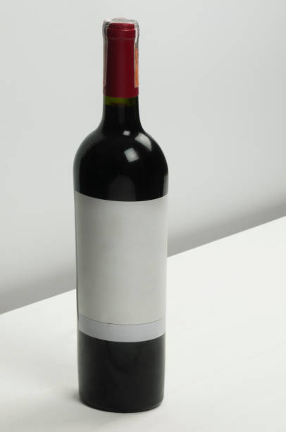 istock Bottle of red wine with blank label on a white background. 1474863097