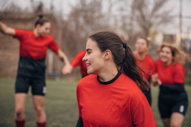 istock Female rugby team celebrating victory 1474867272