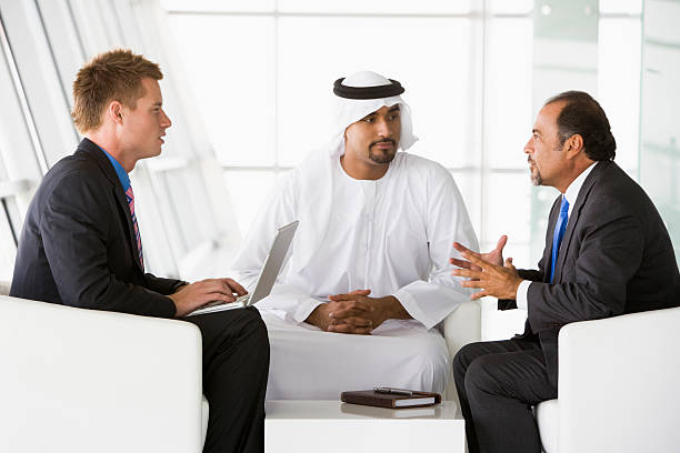 istock Three men on sofa in business meeting 147486922