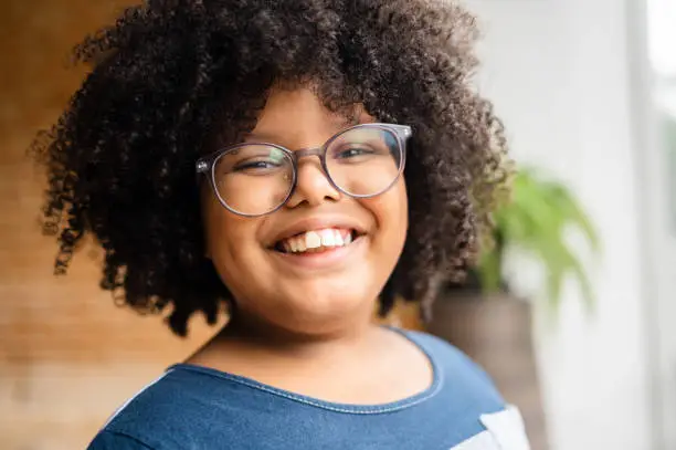 Diversity portrait of a child with curly hair