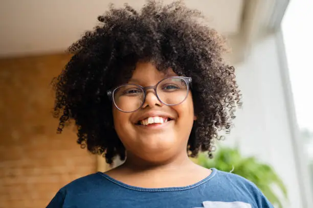 Diversity portrait of a child with curly hair