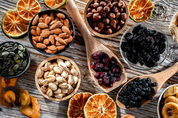 istock Composition with a variety of dried fruits and assorted nuts. 1474872512
