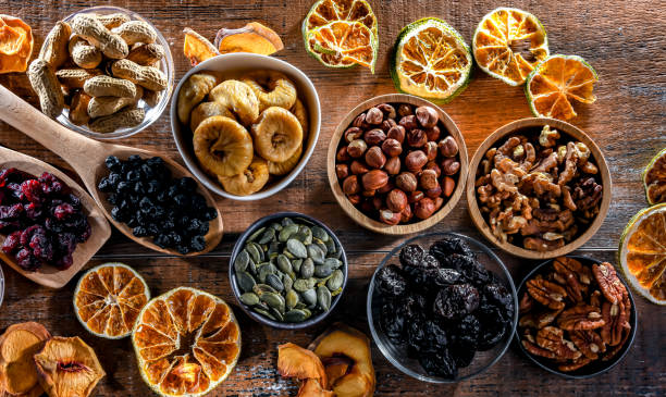 istock Composition with a variety of dried fruits and assorted nuts. 1474872553