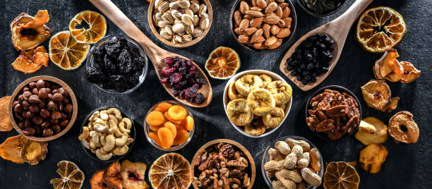 istock Composition with a variety of dried fruits and assorted nuts. 1474873091