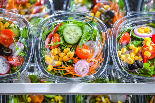 istock Boxes with pre-packaged vegetable salads in a commercial fridge 1474873442