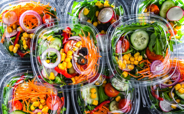 istock Boxes with pre-packaged vegetable salads in a commercial fridge 1474873530