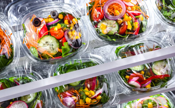 istock Boxes with pre-packaged vegetable salads in a commercial fridge 1474873568