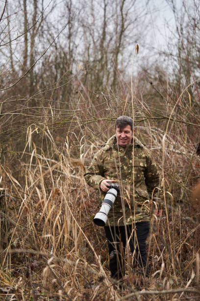 istock Wildlife photographer with camera 1474873805