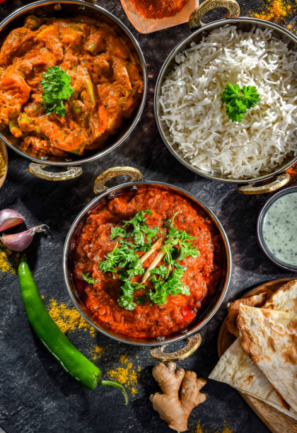 istock Hot madras paneer and vegetable masala with rice 1474873890