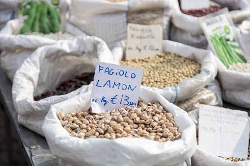 Stock photograph of food market stall with pickled olives and vegetables in old town Granada Andalusia Spain