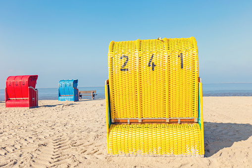 Beach chairs on the North Sea at Spring, Nessmersiel, East Frisia, Lower Saxony, Germany 2023