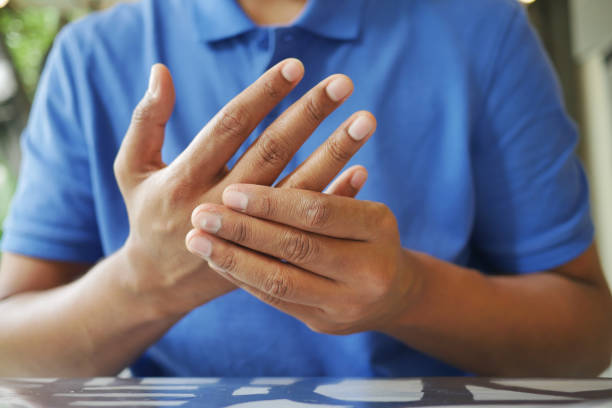 istock man suffering pain in hand close up 1474876476