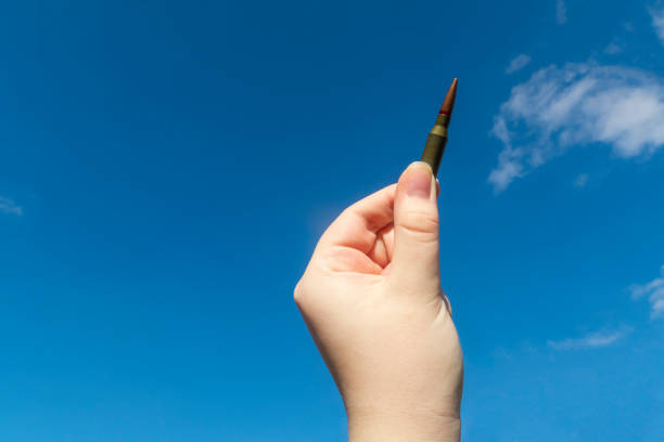 istock Rifle cartridge in hand 1474877381