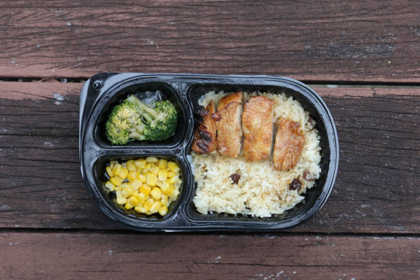 istock curry chicken and rice in a take away plastic packet on table 1474877432