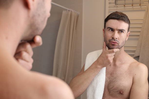istock Handsome man thinking in the bathroom 1474884197