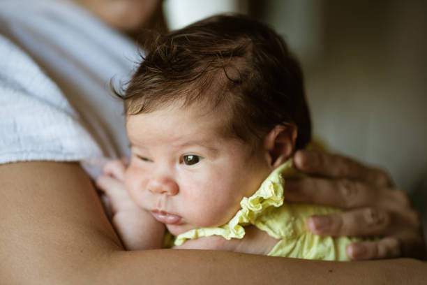 istock Mother holding newborn baby 1474892427