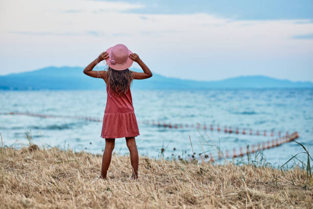 istock Beautiful girl enjoying summer vacation 1474893279