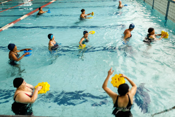 istock Women doing aqua-aerobics 1474893924