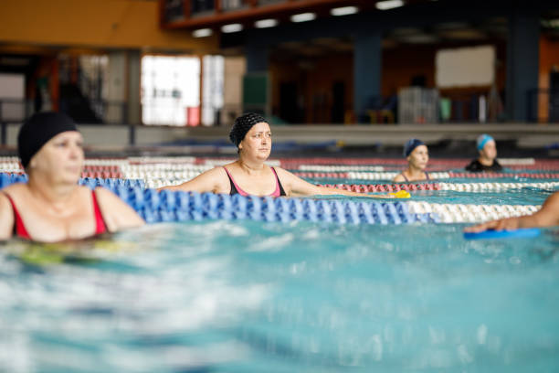 istock Women exercising in an aqua-aerobics class 1474894016