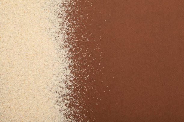 Organic Teff Flour scattered on brown background with copy space. Selective focus, Design element. Teff flour is Trendy Superfood