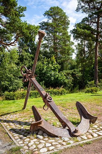 Anchor as an object of decoration on the dry land.