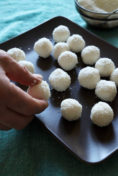 istock Man making delicious dessert with coconut and white chocolate. 1474897595