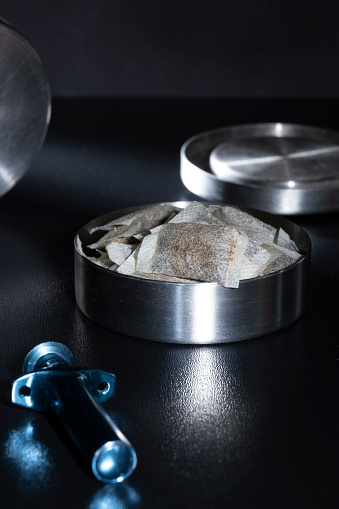 Closeup Of A Metallic Swedish Snus Can With White Portion Snus Pouches A  Blue Loose Snus Portioner In The Foreground Stock Photo - Download Image  Now - iStock