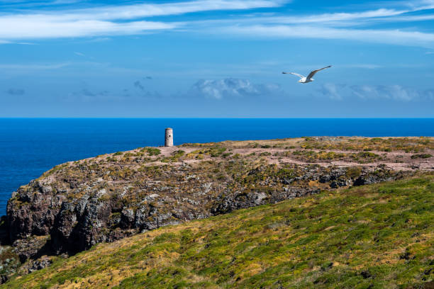 istock Cliffs At Atlantic Coast With Ancient Lighthouse At Cap Frehel In Brittany, France; Phare du Cap Frehel 1474898672