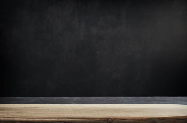 istock empty table with wooden board and dark background 1474898745