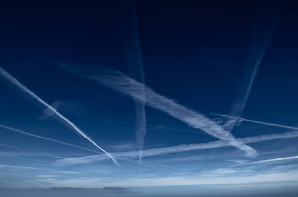istock Blue Sky With Grid Of White Condensation Trails, Contrails, From Airplane 1474898779