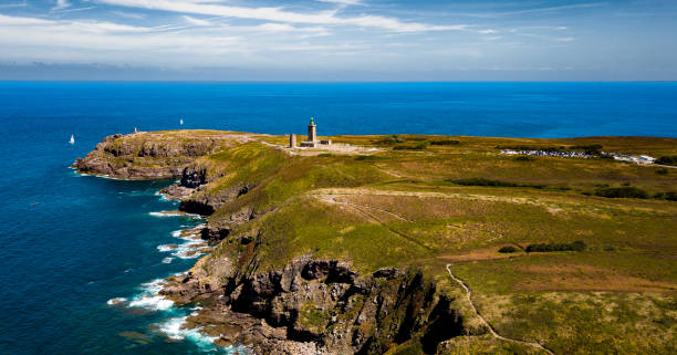 istock Cliffs At Atlantic Coast With Ancient Lighthouse At Cap Frehel In Brittany, France; Phare du Cap Frehel 1474898816