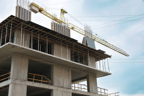 istock Construction site with tower crane near unfinished building 1474901219