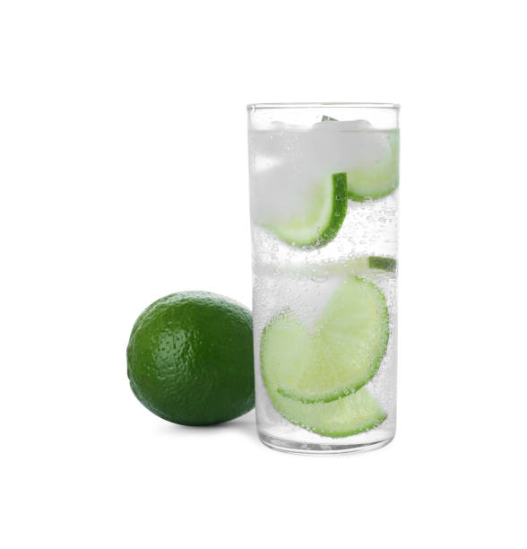 istock Glass with water, sliced lime and ice on white background 1474901608
