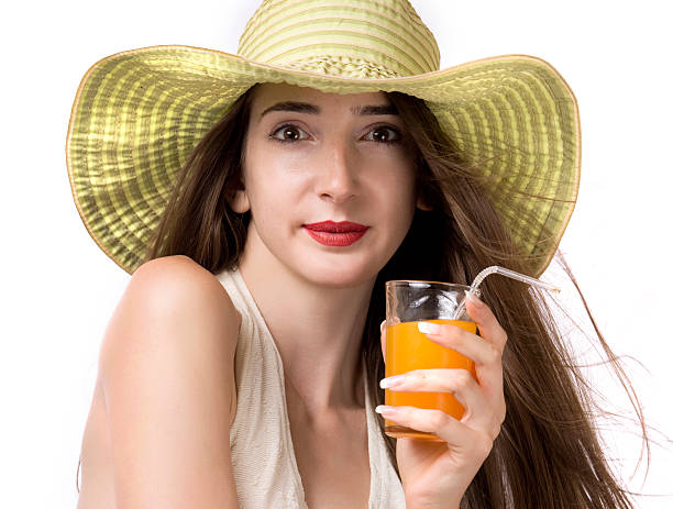 istock Attractive woman sipping orange juice 147490175